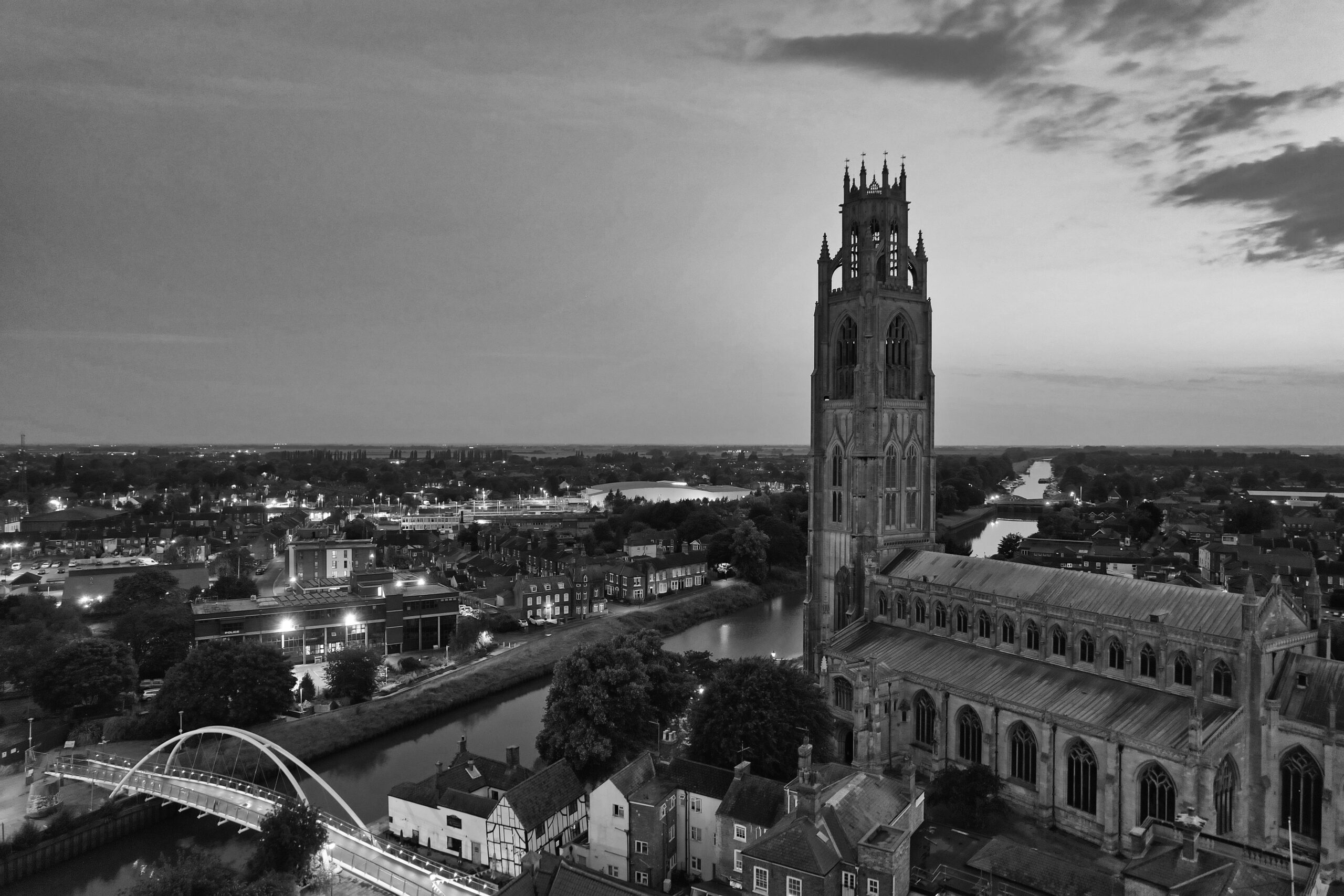 Aerial black and white photo of Boston Stump, highlighting the historic Gothic architecture at twilight.